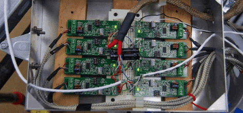 photo of amplifiers and strain gauges wired on a bread board