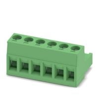 A green, nearly rectangular prison whose length is about twice its almost equivalent width and depth. The side away from the viewer appears to have an indent along the lower edge such that the object's cross-section looks like a fat, inverted "L". Six square holes of nearly equal height and width appear along the lower edge of the object's long side. Six round holes appear on the top of the object, along the closest edge to the viewer. Slightly raised "fins" appear between the round holes.