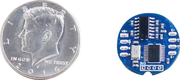 Image of a US quarter next to the internal electronics of the A1A-D25 circuit board to illustrate that the internal board is smaller than the currency