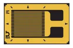 A rectangle with a yellow border containing black alignment markings in the shape of triangles with a black center. Superimposed in the center is a thin black line back and forth, creating the effect of a dark yellow square occupying the left two thirds within the border. The right third appears to have a sideways "T" shape in yellow that connects with the border, with a black background.