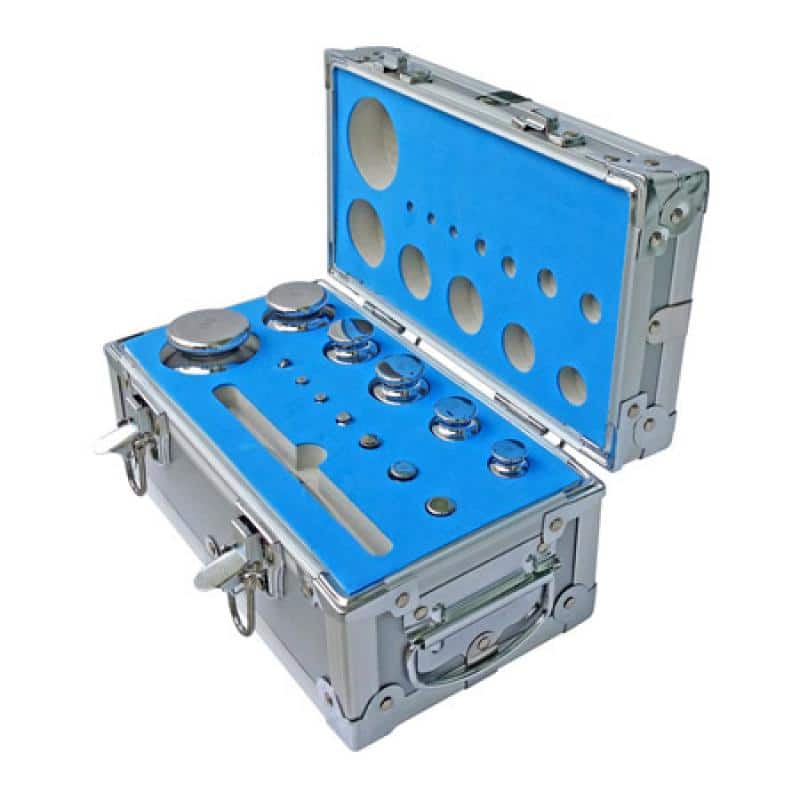 A photo of a steel case with blue protective insert in both the base and lid, with ANYLOAD TWSM1 steel test weights inside the protective insert hollows.