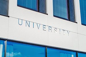 photo of a closeup of a building that says "university" on the side